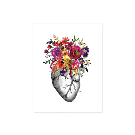 vintage etching of an anatomical heart topped with watercolor flowers in shades of pink, purple, yellow, and golden tones printed on matte white paper