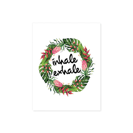 watercolor tropical leaves and flowers in a wreath shape with the words inhale exhale in black in printed on matte white paper