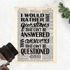 I would rather have questions that can't be answered than answers that can't be questioned quote by Richard Feynman in black ink on a salvaged dictionary page