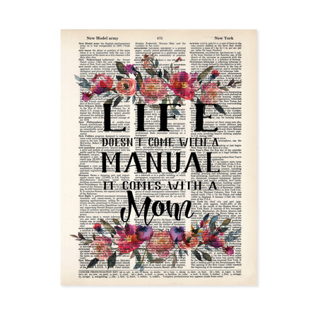 Watercolor flowers in pinks and peach tones top and bottom with the words Life doesn't come with a manual it comes with a mom in between printed on a salvaged dictionary page