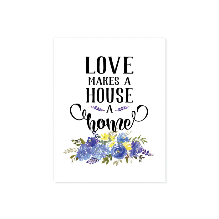 love makes a house a home printed above a spray of blue flowers with greenery on matte white paper