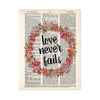 love never fails surrounded by a wreath of pink and coral watercolor flowers with greenery printed on dictionary page