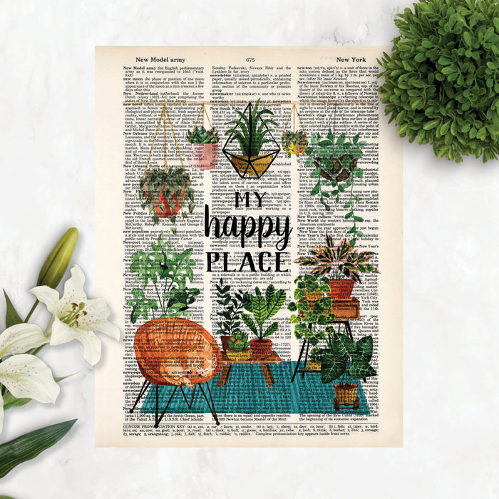 my happy place surrounded by haing plants and plants on a teal blue rug with plant stands and more plants, there is also a wicker chair with a yellow cat curled up sleeping printed on dictionary page