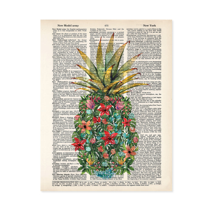 watercolor monstera leaves along with pink, red, peach, and blue flowers along with red and blue shells and coral form a pineapple shape with a traditional pineapple top printed on a dictionary page