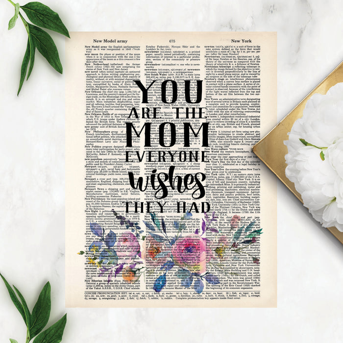 you are the mom everyone wishes they had with watercolor lowers in pink, blue and yellow printed on a dictionary page